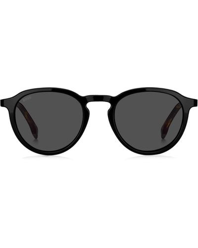 BOSS Schwarze Sonnenbrille mit Havanna-Muster an den Bügeln und 360-Grad-Scharnieren