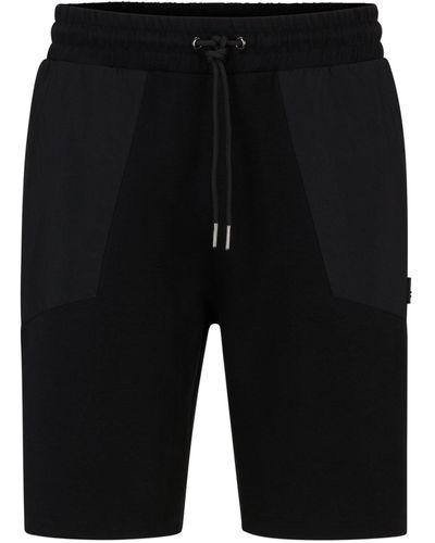 HUGO Relaxed-Fit Shorts aus Stretch-Baumwolle mit Kontrast-Taschen - Schwarz