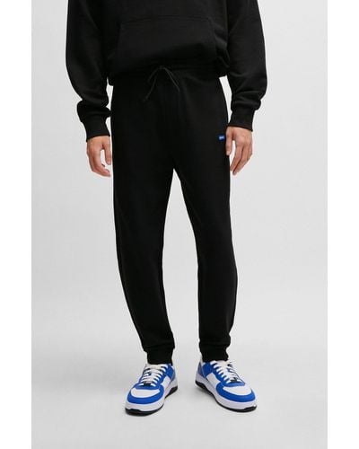 HUGO Cotton-terry Tracksuit Bottoms With Blue Logo Patch - Black