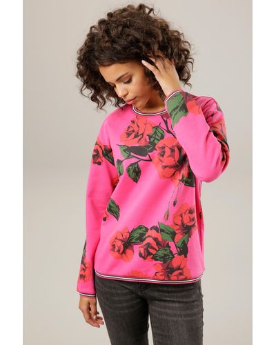 Aniston CASUAL Sweatshirt, mit farbenfrohem Rosendruck - Pink