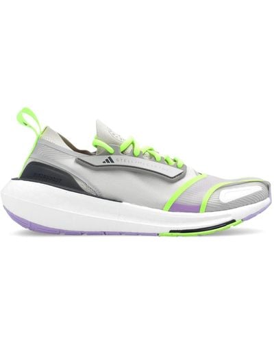 https://cdna.lystit.com/400/500/tr/photos/italist/065e552e/adidas-by-stella-mccartney-Gobi-Semiflash-Green-Ultraboost-23-Sneakers.jpeg