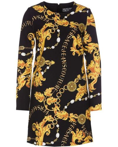 Versace Jeans Couture Mini Black And Gold Dress With All-over Barroque Logo Print In Stretch Fabric Woman