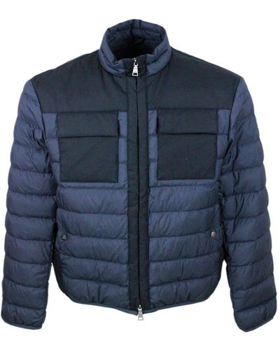 Add 100 Gram Down Jacket With High Quality Feathers. Technical Fabric Details And Chest Pockets. The Closure Is With Zip - Blue