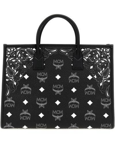 MCM: tote bags for woman - Black  Mcm tote bags MWTDABO17 online