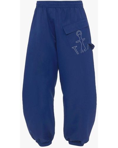 JW Anderson Twisted Sweatpants With Anchor Logo Print - Blue