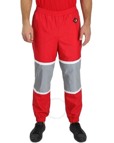 Burberry Striped Nylon Logo Graphic Trackpants - Red