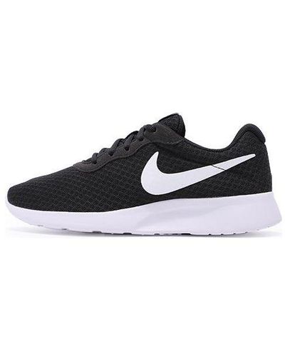 Nike Tanjun Sneakers for Women - Up to off | Lyst