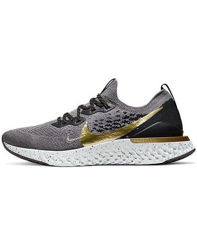 Nike epic react store black gold