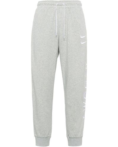 Nike Sportswear Swoosh Logo Slim Fit Bundle Feet Sports Long Pants - Gray