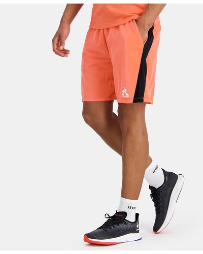 Le Coq Sportif Short con logo pequeño - Naranja