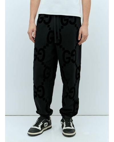Gucci Gg Flocked Print Cotton-fleece Track Pants - Black