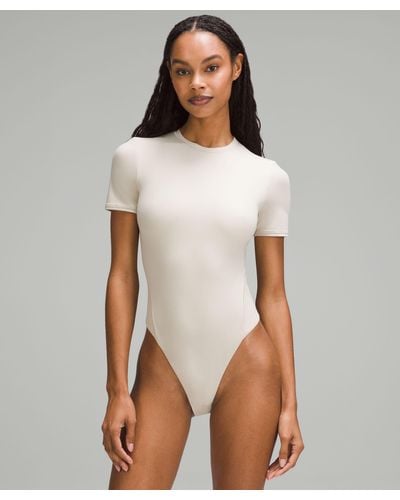 White Short Sleeve Bodysuits for Women - Up to 61% off