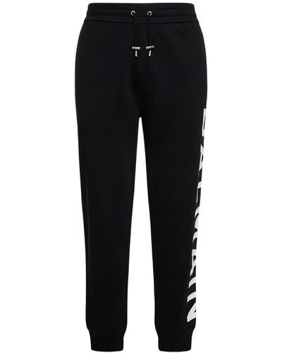 Balmain Pantalones deportivos de algodón estampados - Negro