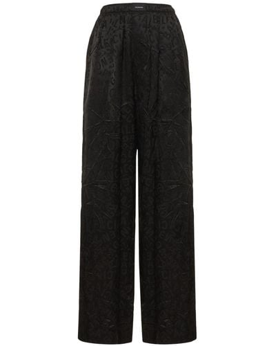 Balenciaga Pantalon de pyjama en soie jacquard à logo - Noir