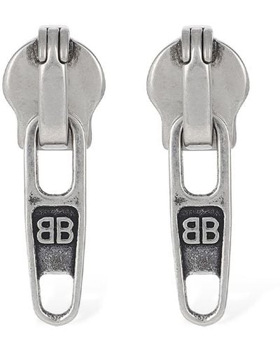 Balenciaga Xs zip-up brass earrings - Bianco