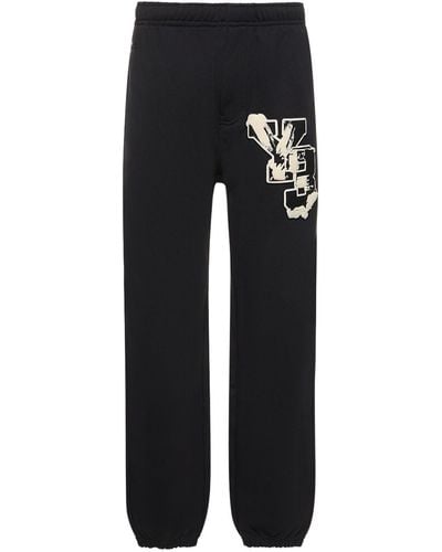 Y-3 Pantalones gfx de felpa de algodón - Negro