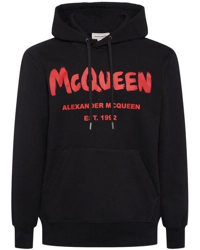 Alexander McQueen Kapuzensweatshirt mit mcqueen graffiti-motiv - Schwarz