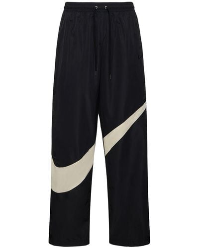 Nike Pantalon en nylon tissé swoosh - Bleu