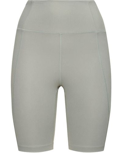 GIRLFRIEND COLLECTIVE Shorts running cintura alta de tech stretch - Gris