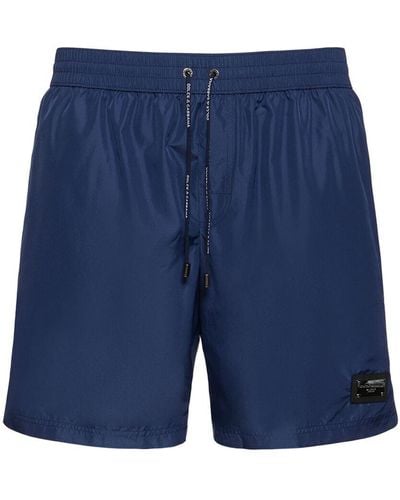 Dolce & Gabbana Solid Color Swim Shorts W/ Logo Plaque - Blue
