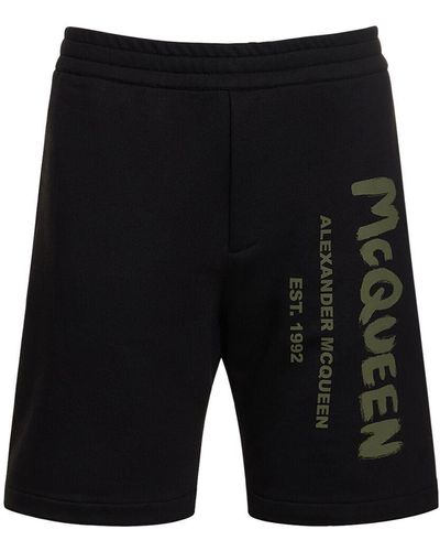Alexander McQueen Shorts de felpa de algodón con logo graffiti - Negro
