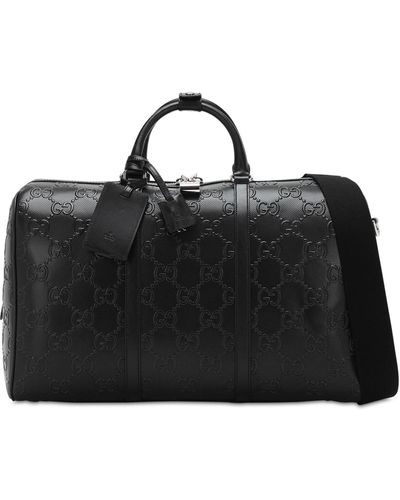 Gucci Reisetasche aus geprägtem GG Leder - Schwarz