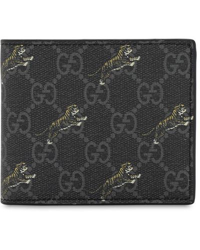Gucci Portefeuille avec porte-monnaie GG à imprimé tigre - Noir