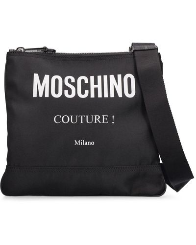Moschino Sac bandoulière en nylon imprimé logo - Noir