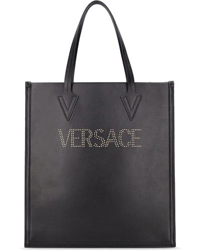 Versace Bolso tote de piel con logo y tachuelas - Negro