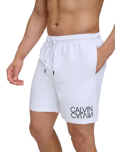 Calvin Klein Reflection Logo Elastic Waist 7" Volley Swim Trunks - White