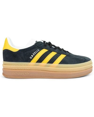 adidas Stylische gazelle sneakers in schwarz/gold/weiß - Blau