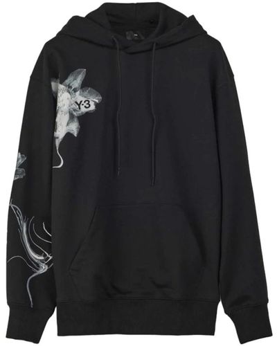 Y-3 Schwarzer oversize hoodie mit grafischem logo,kapuzenpullover mit blumenmuster