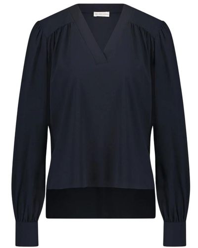 Jane Lushka Elegante blusa in jersey tecnico | blu con stampa gioiosa