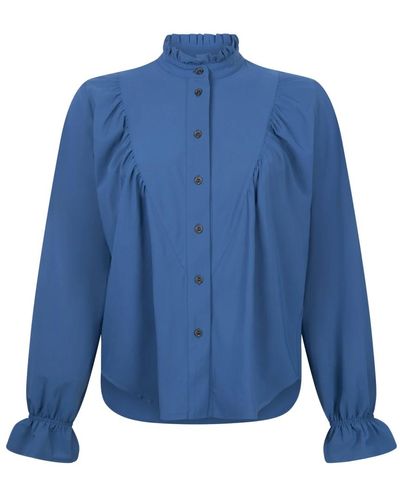 Jane Lushka Blusa sofisticada roberta en azul claro