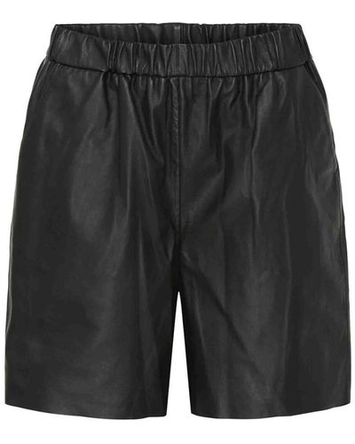 Btfcph Shorts de cuero negro con cintura elástica