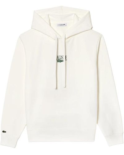 Lacoste Weiße trendige sweatshirt mit ikonischem druck