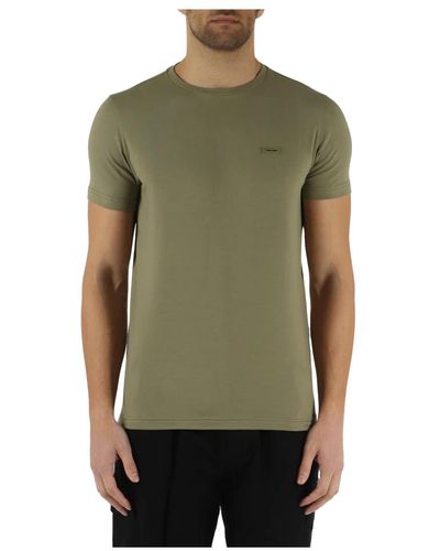 Calvin Klein Slim fit t-shirt aus stretch-baumwolle mit frontlogo-patch - Grün
