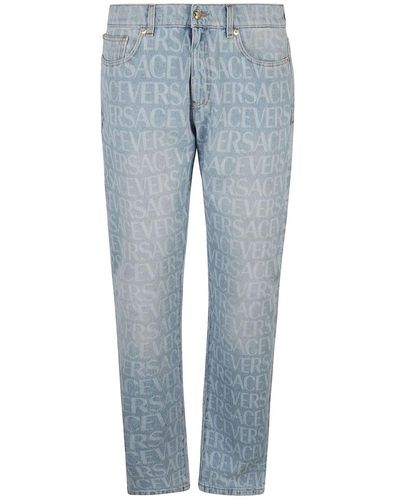 Versace Klare blaue jeans mit grafischem druck