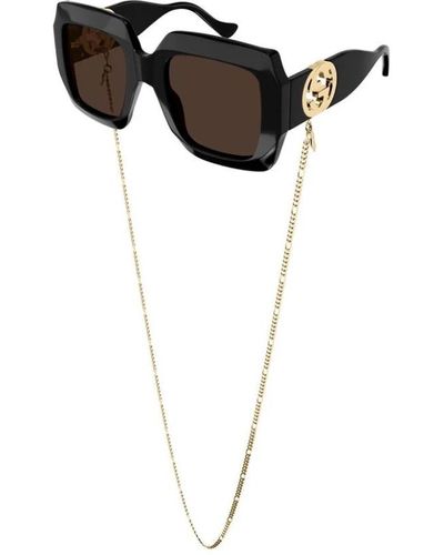 Gucci Gafas de sol con cadena dorada negra/marrón