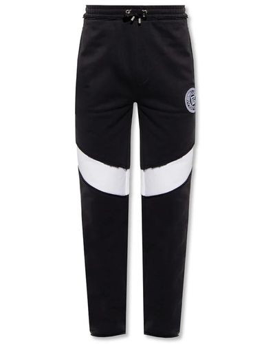 Balmain Pantaloni in cotone neri con stampa logo - Nero