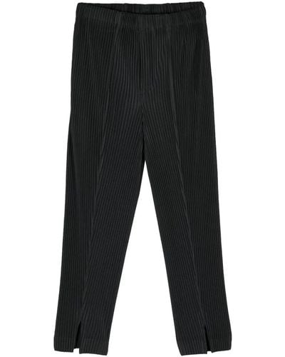 Issey Miyake Pantaloni plissé neri con effetto pieghe - Nero