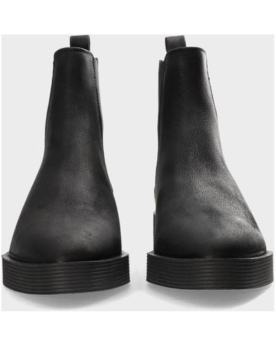 COPENHAGEN Schwarze gewachste nabuc ankle boots mit elastischen einsätzen