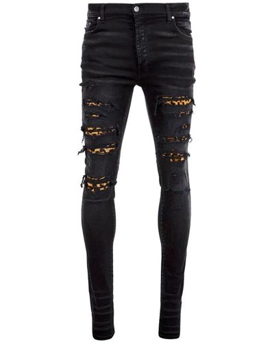 Amiri Slim-fit leopard denim jeans - Schwarz