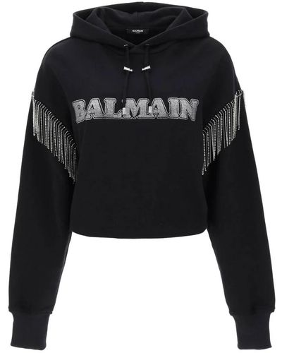 Balmain Cropped hoodie mit rhinestone-logo - Schwarz