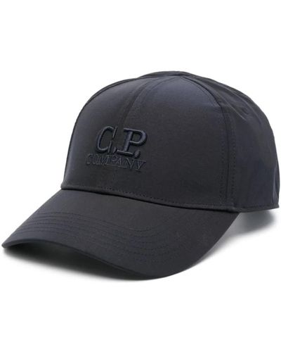 C.P. Company Blaue logo-mütze mit gebogenem schirm