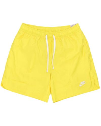 Nike Gewebte gefütterte flow shorts - Gelb