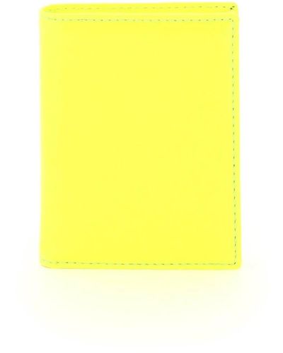 Comme des Garçons Geldbörse aus fluoreszierendem leder mit goldgedrucktem logo - Gelb