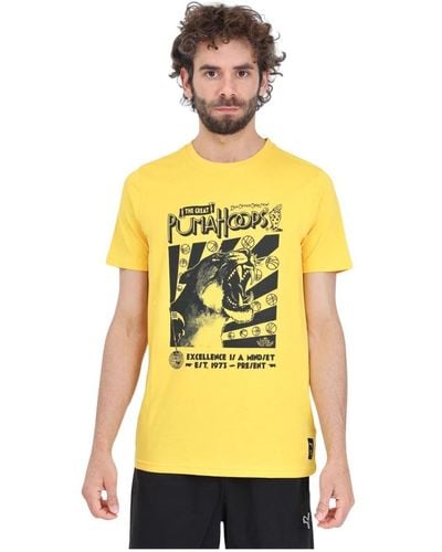 PUMA Gelbes t-shirt mit schwarzem logo-druck