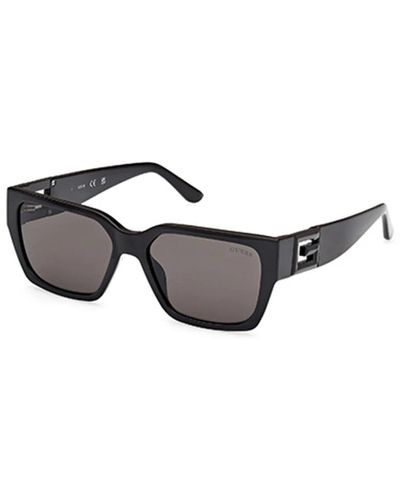 Guess Stylische sonnenbrille in schwarz und grau,stilvolle gelbe sonnenbrille mit grauen gläsern