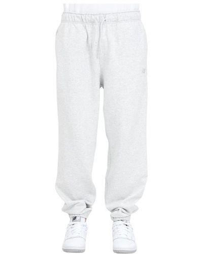 New Balance Pantaloni grigi con logo - Bianco